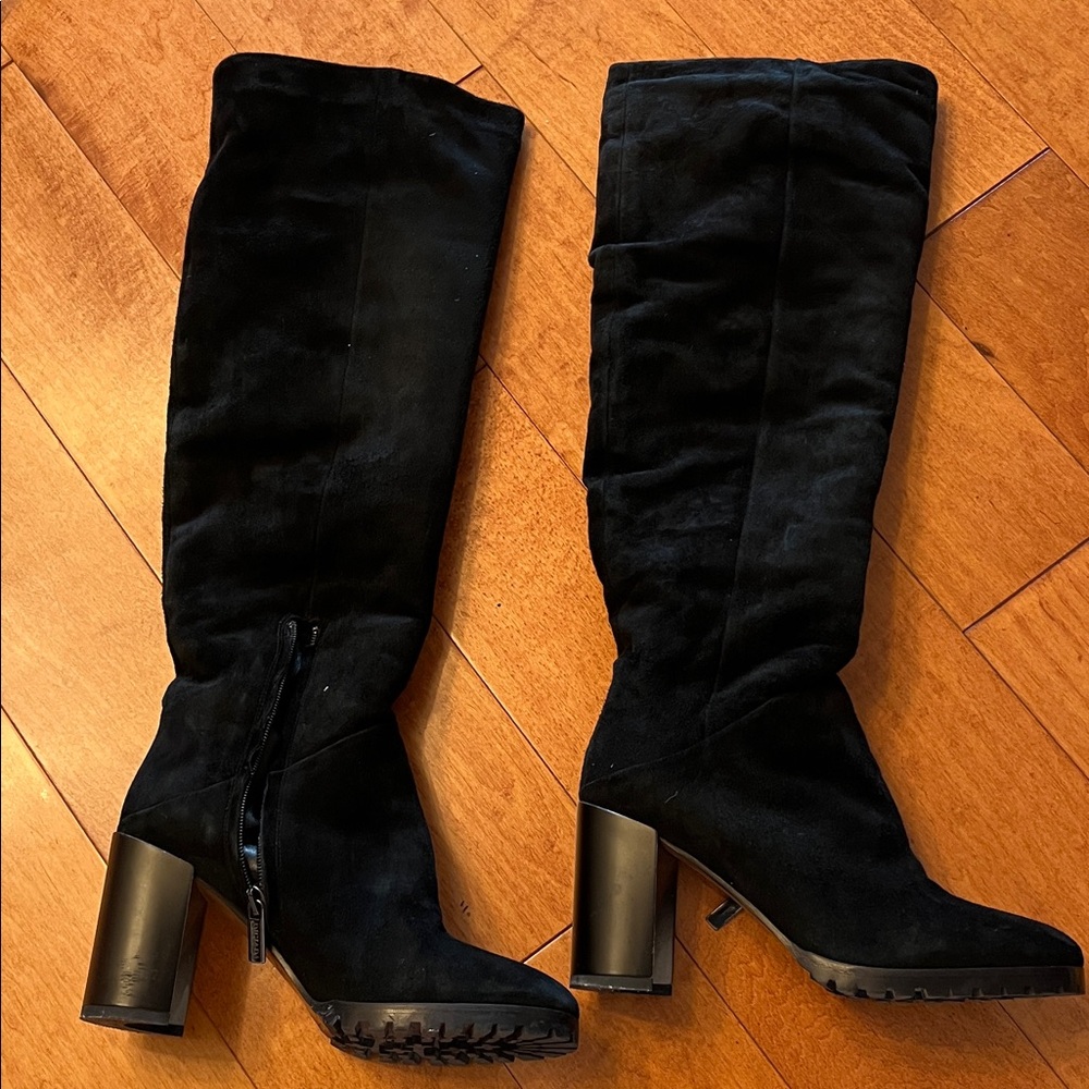 Black suede and shearling lined knee high boots with heels
